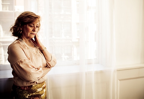 Alzheimers-Disease - Smart-Fill Woman standing and thinking to herself