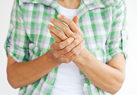 Psoriatic-Arthritis - Smart-Fill Man rubbing his hands together